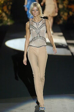 beige embellished sleeveless top and fitted pants