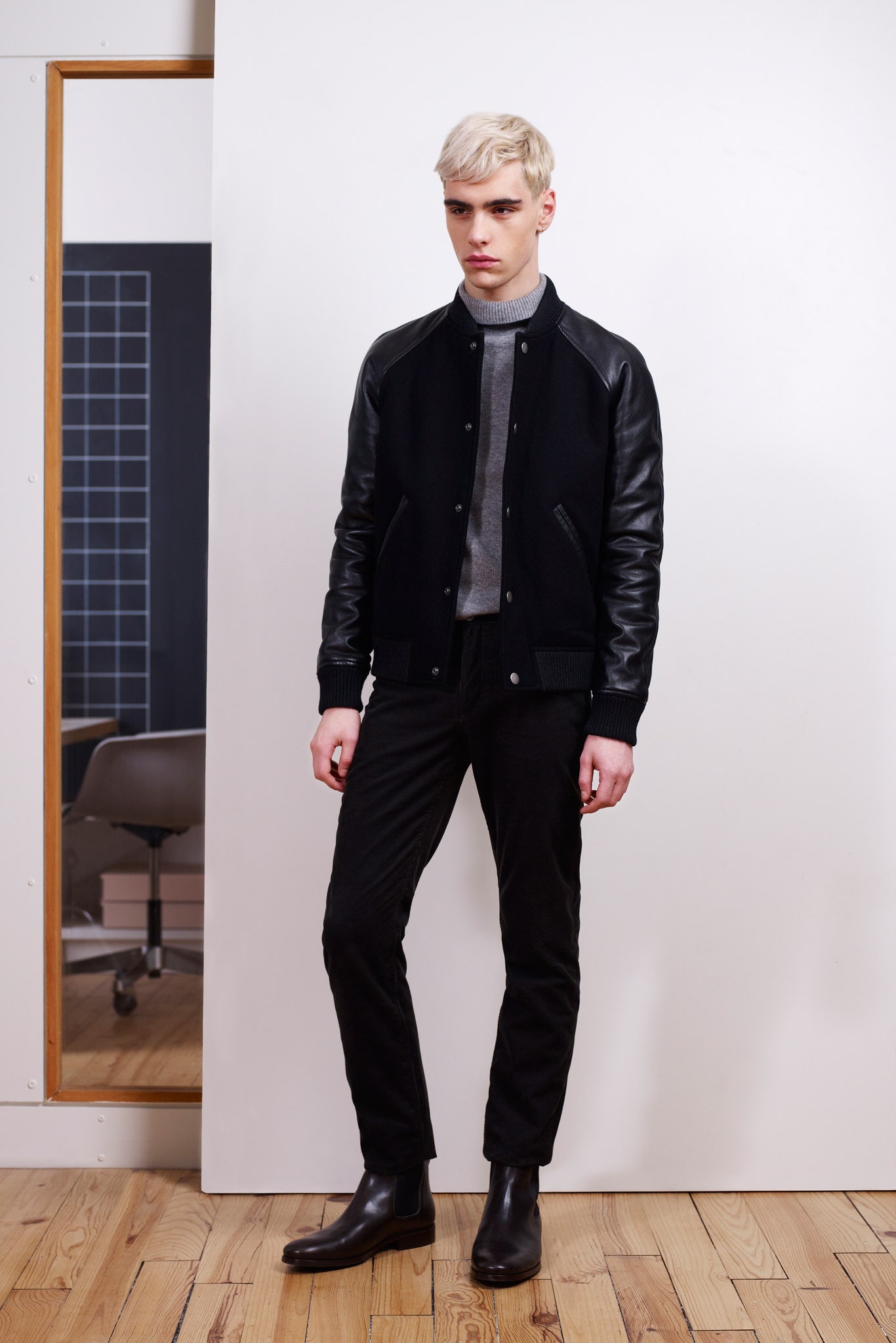 black fitted jacket with gray turtleneck