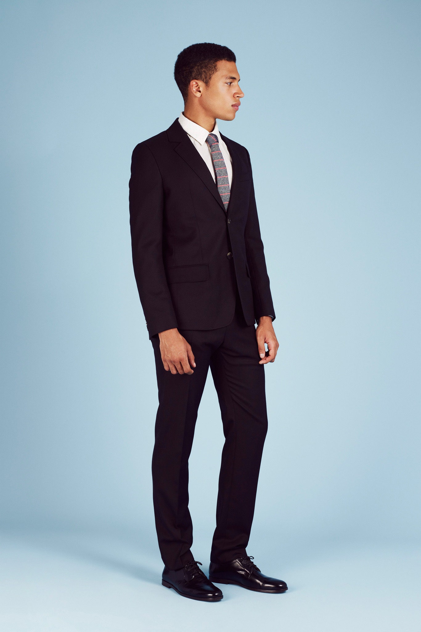 black tailored suit with white shirt