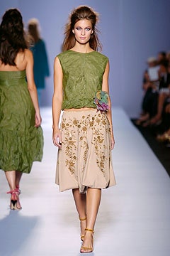 green relaxed top with beige skirt