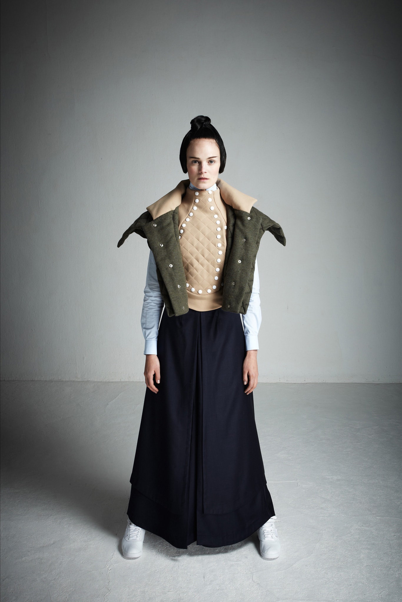 beige fitted sleeveless top with olive jacket