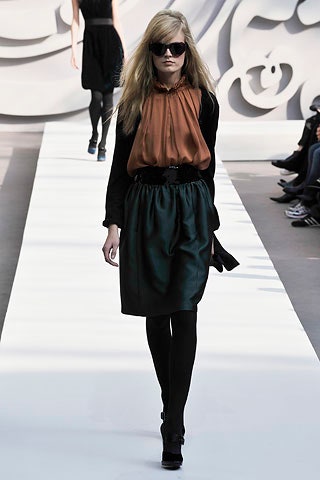 orange silk blouse and green skirt