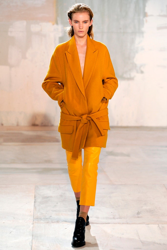 yellow oversized coat with orange pants
