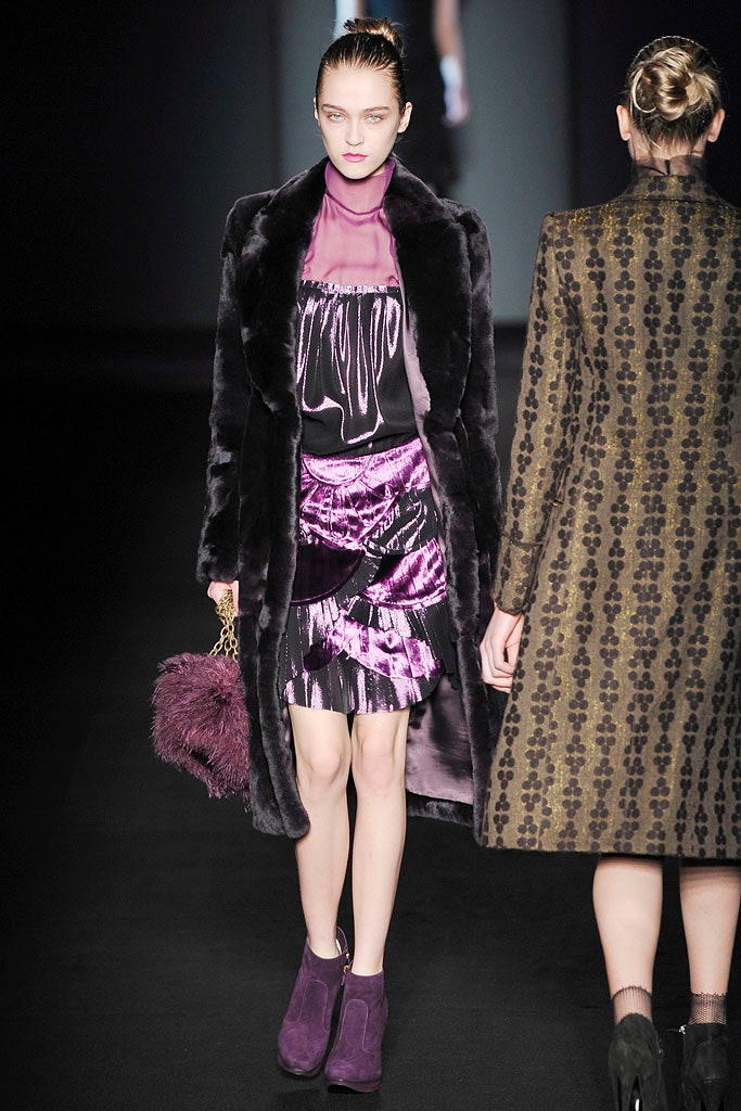 black faux-fur coat and purple silk dress