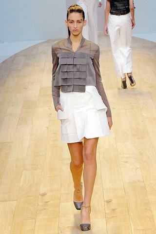 gray pleated top and white skirt