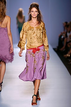 gold silk blouse and purple skirt