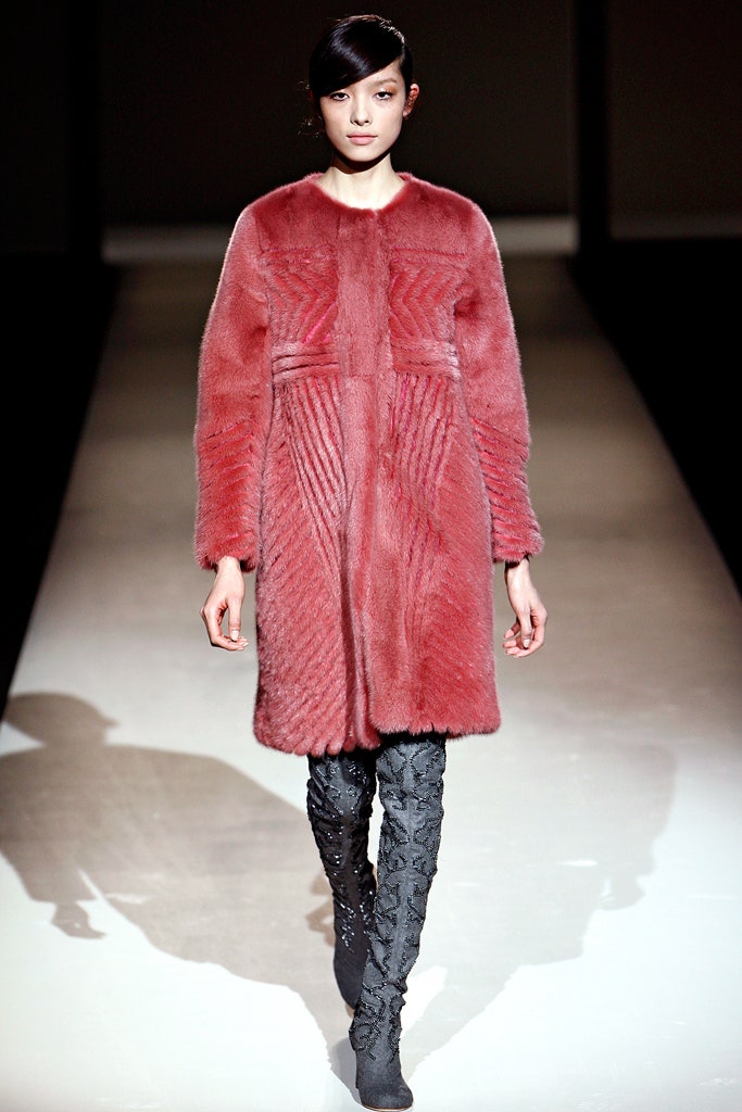 red fur coat with black pants