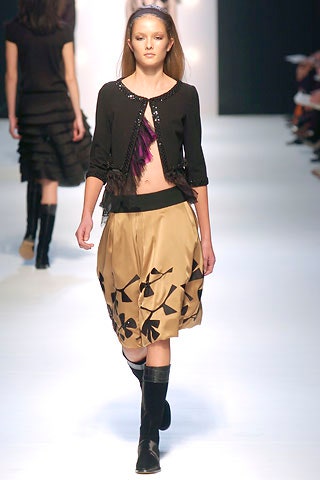 black jacket and beige skirt