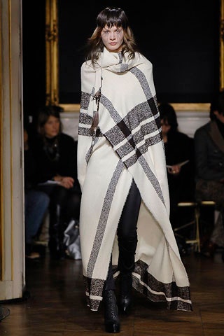 white striped wool poncho with black pants