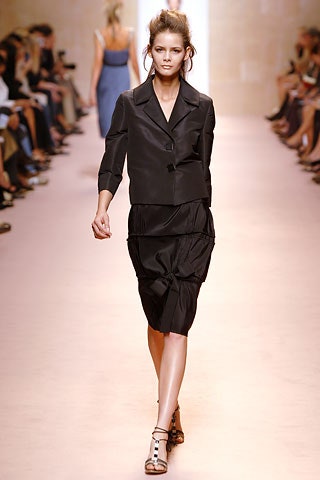 black silk fitted jacket and skirt