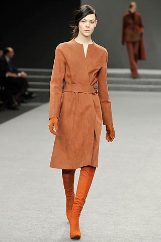 brown suede belted coat with orange accessories