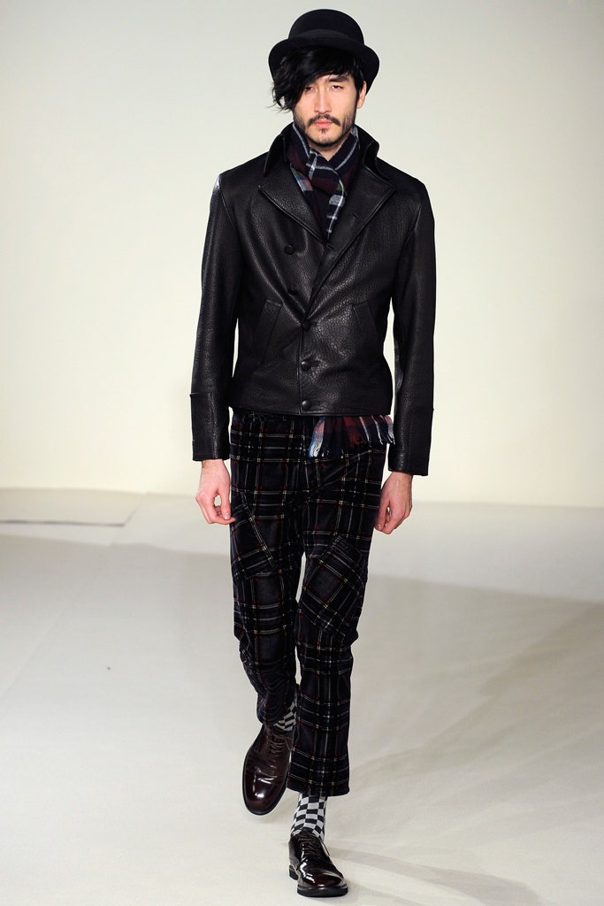 black leather jacket and checked pants