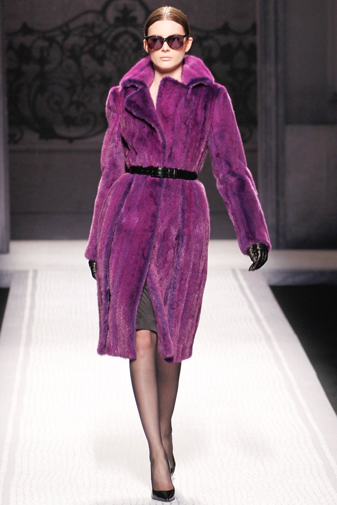purple faux-fur coat with black dress