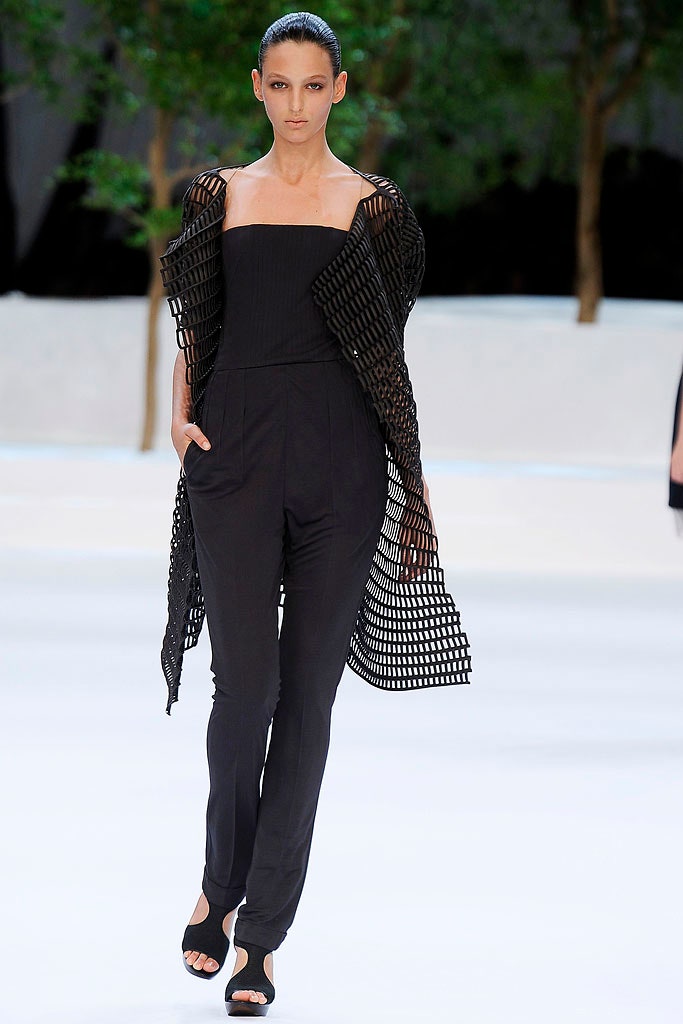 black fitted jumpsuit with mesh cape