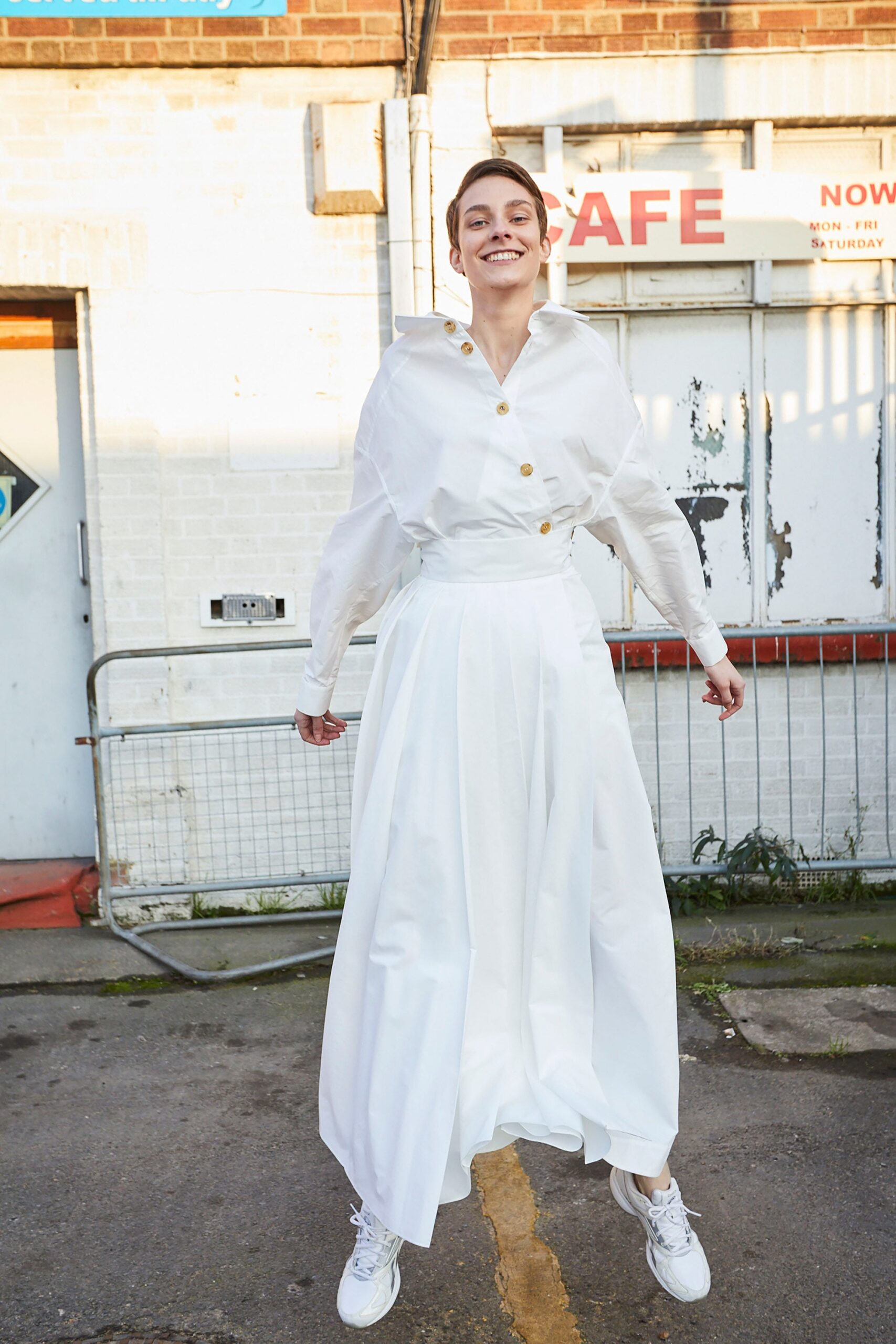 white cotton long-sleeve collared relaxed buttoned tiered dress