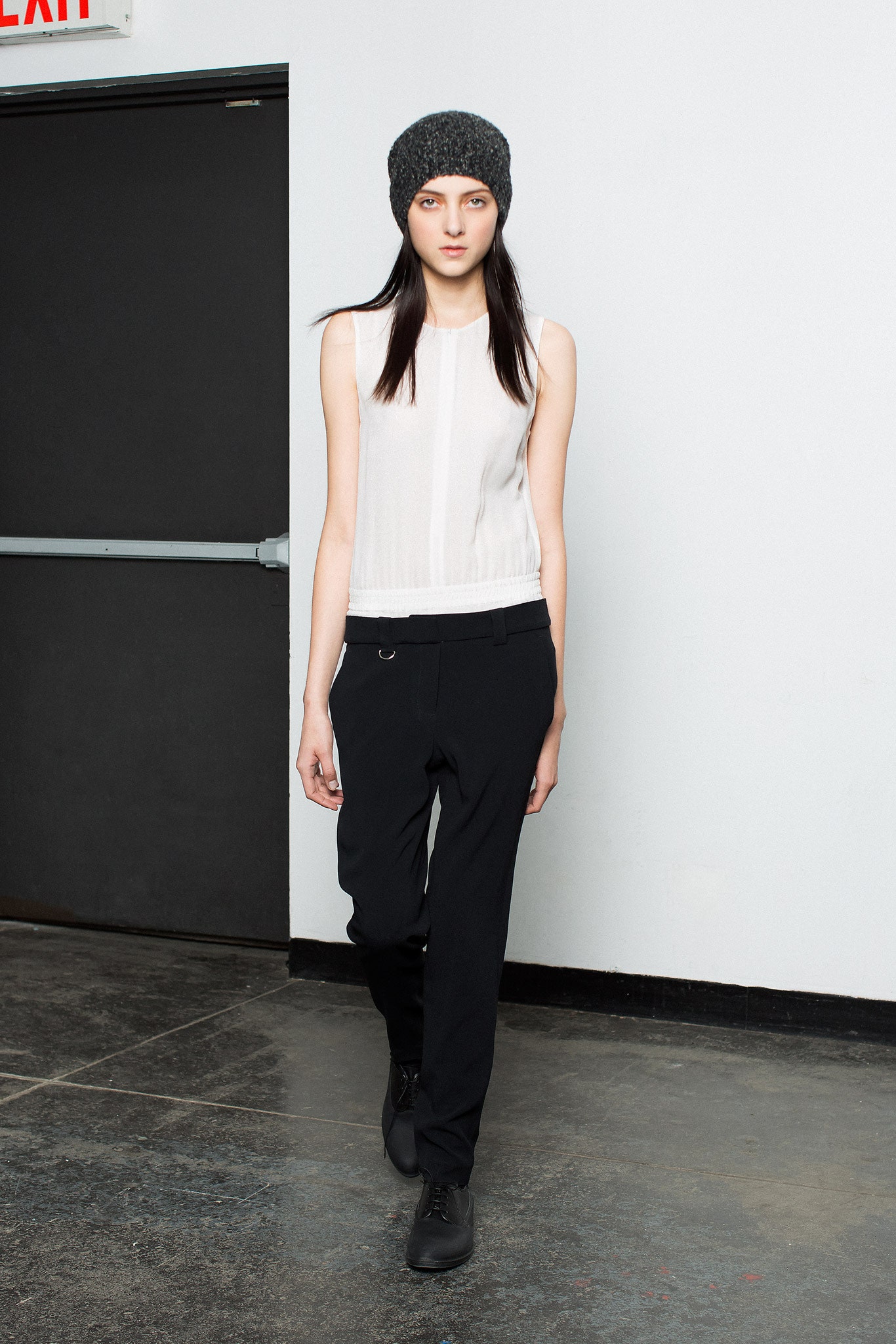 white fitted top with black pants