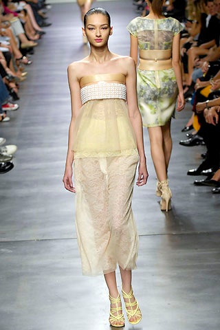 yellow silk strapless top and beige lace midi skirt