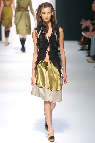 black fringed vest and layered skirt