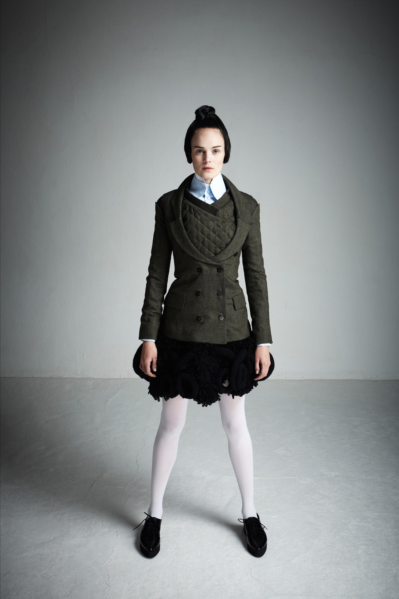 green jacket white blouse black skirt