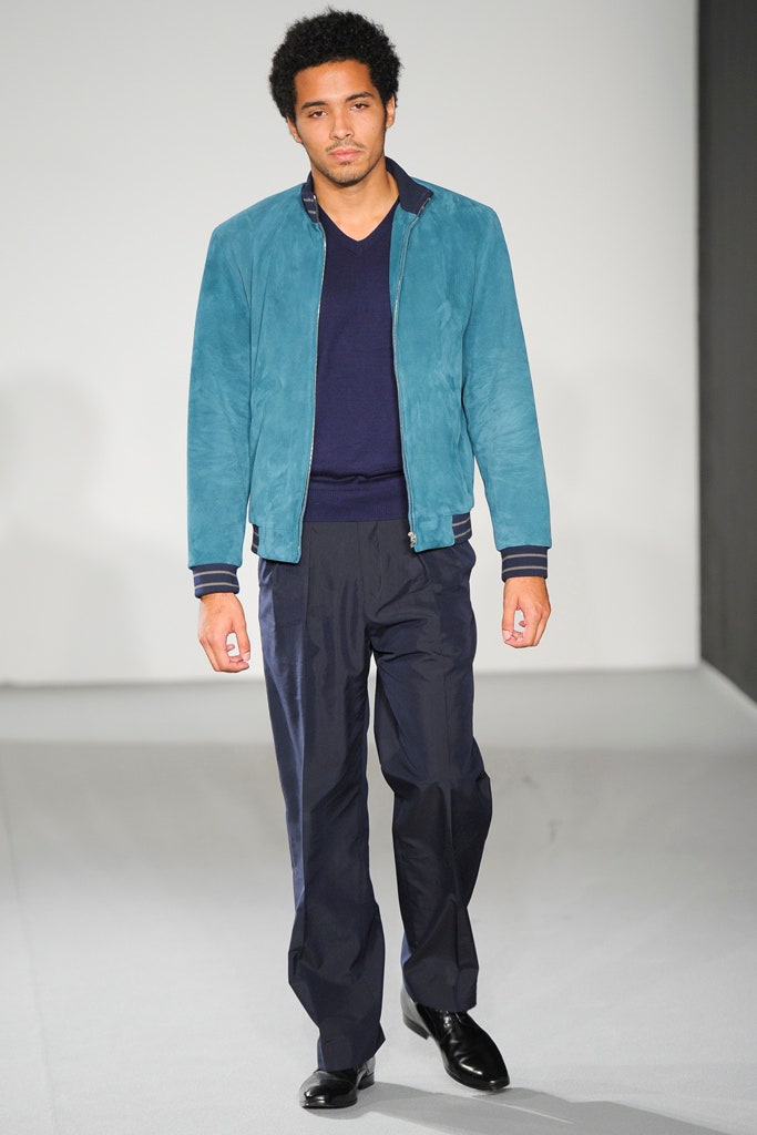 teal suede jacket with navy shirt
