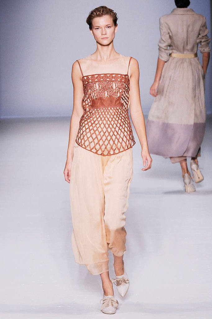 brown silk sleeveless top and beige wide-leg pants
