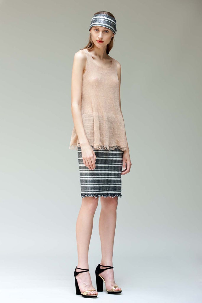 beige relaxed top with striped skirt
