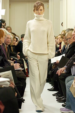 white wool turtleneck sweater and beige tailored pants