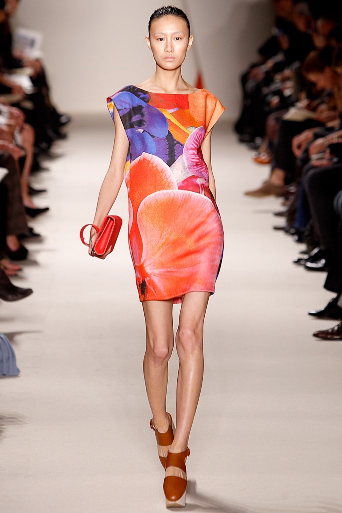 floral mini-dress with red clutch