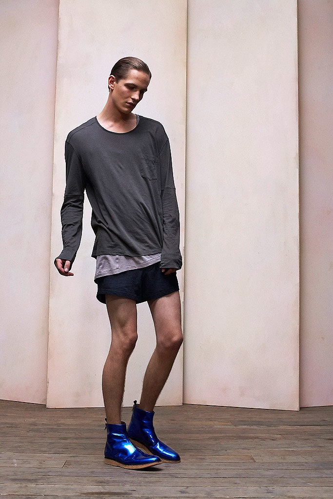 gray shirt black shorts blue boots