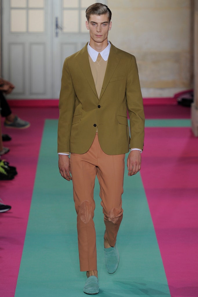 green tailored blazer with orange pants