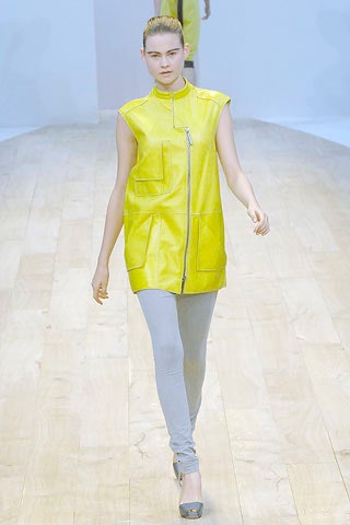 yellow leather sleeveless top with gray leggings