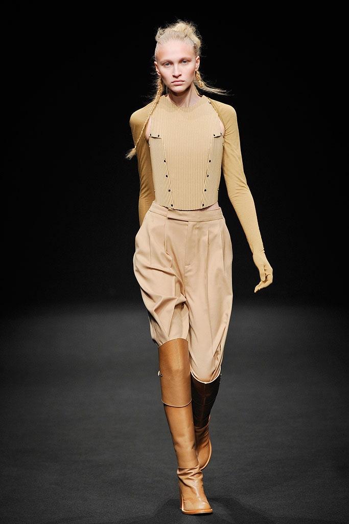 beige bodysuit and relaxed pants