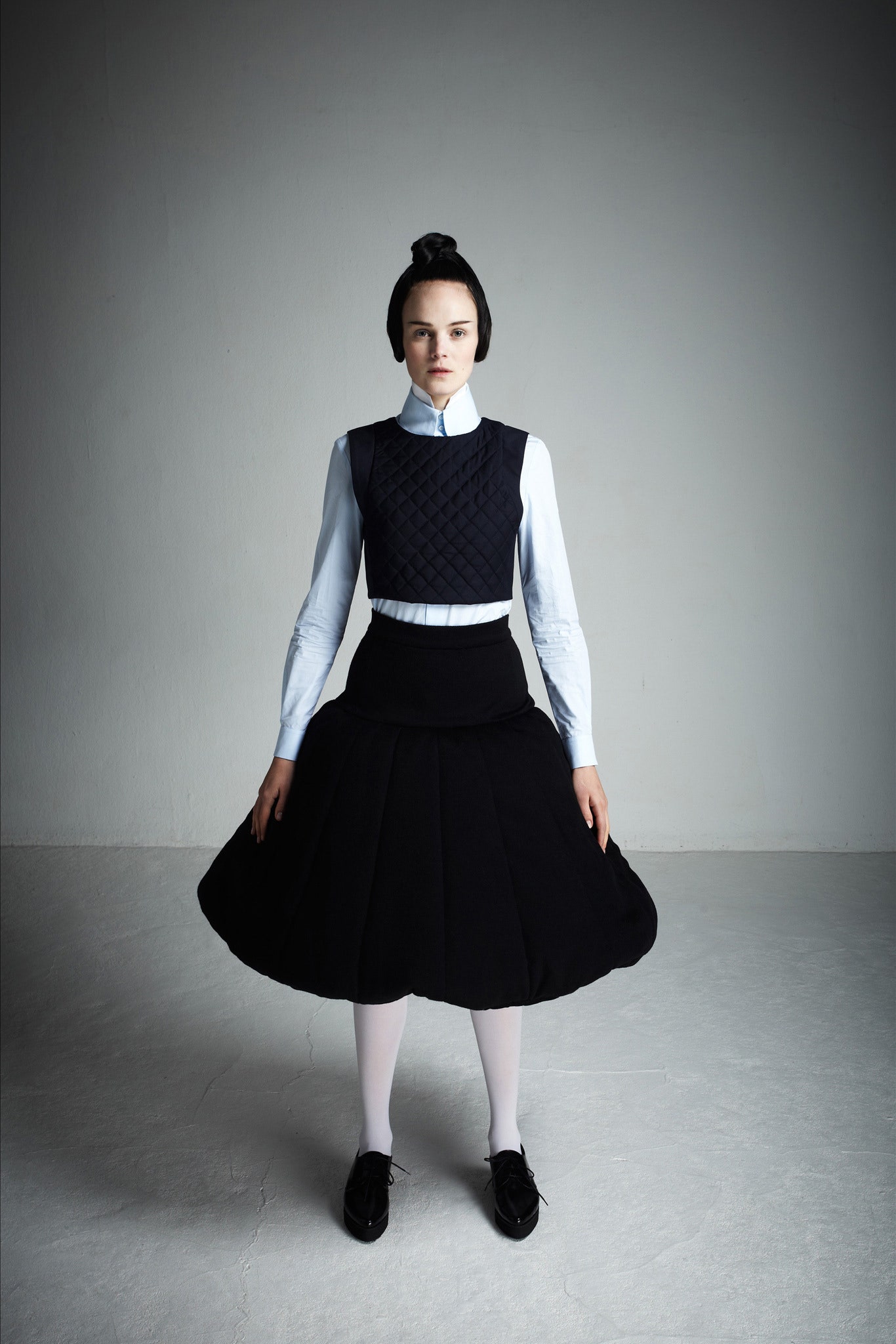 blue collared top black quilted vest