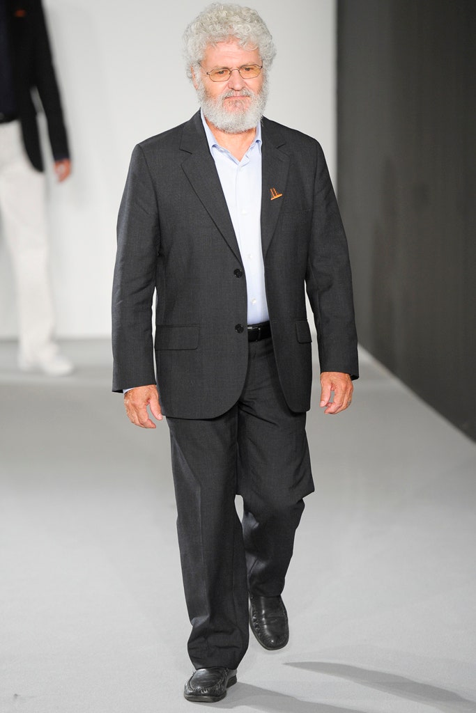 black tailored suit with light blue shirt