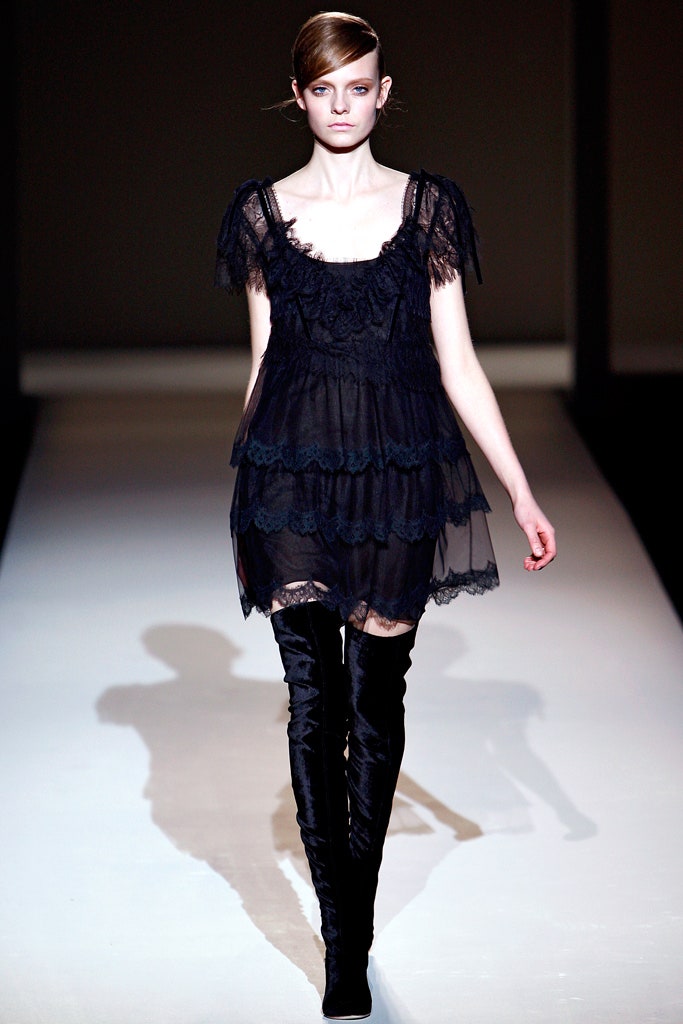 black lace mini dress with over-the-knee boots