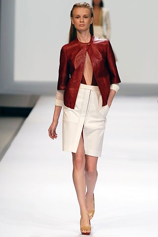 red leather fitted jacket and white skirt