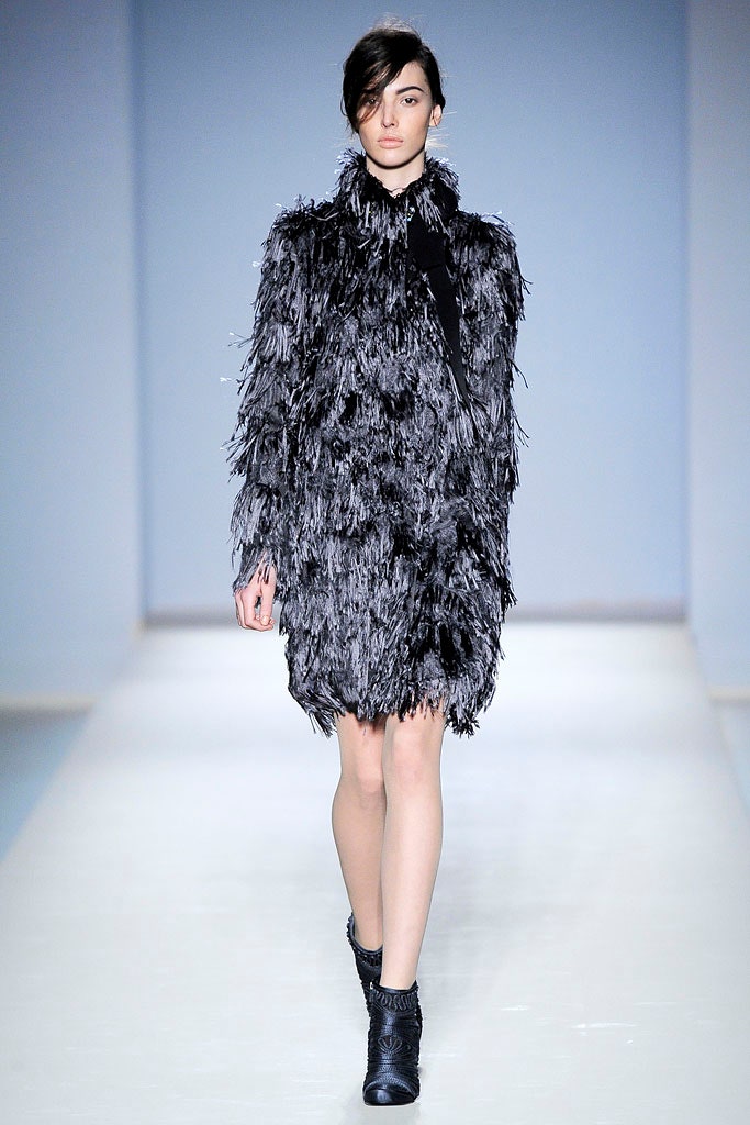 black fringed fur coat