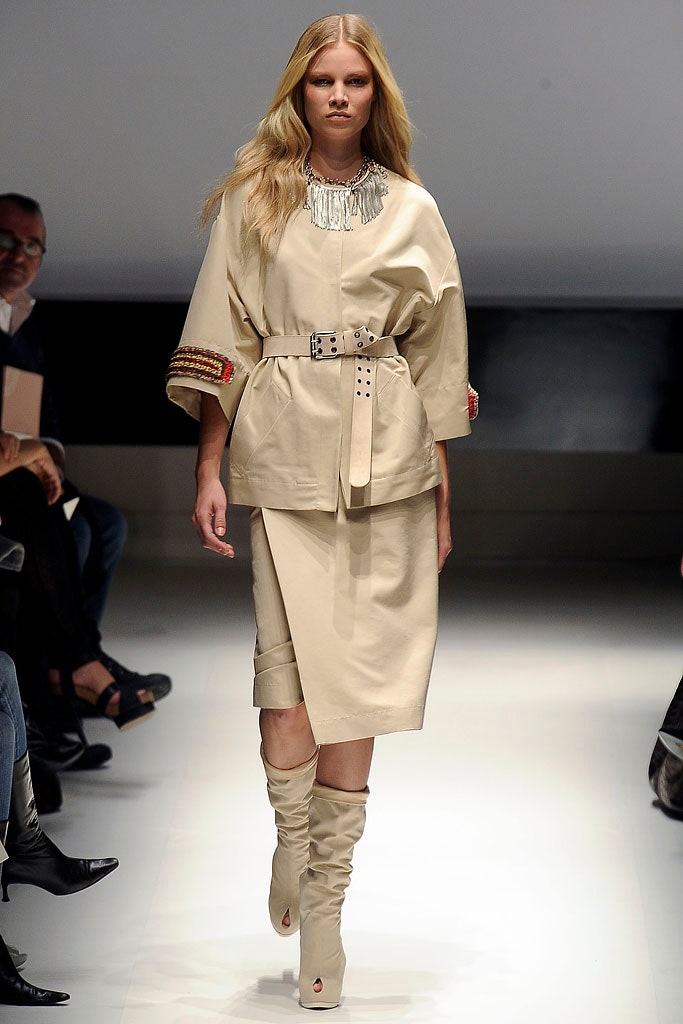 beige fitted top and skirt with boots