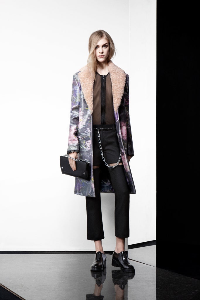 multi floral vinyl coat with black blouse