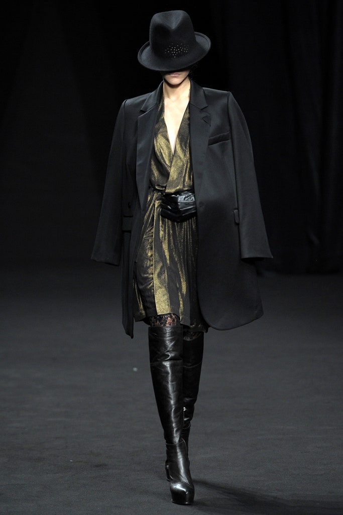 gold silk fitted dress with oversized black coat