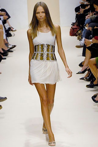 white mini dress with gold corset