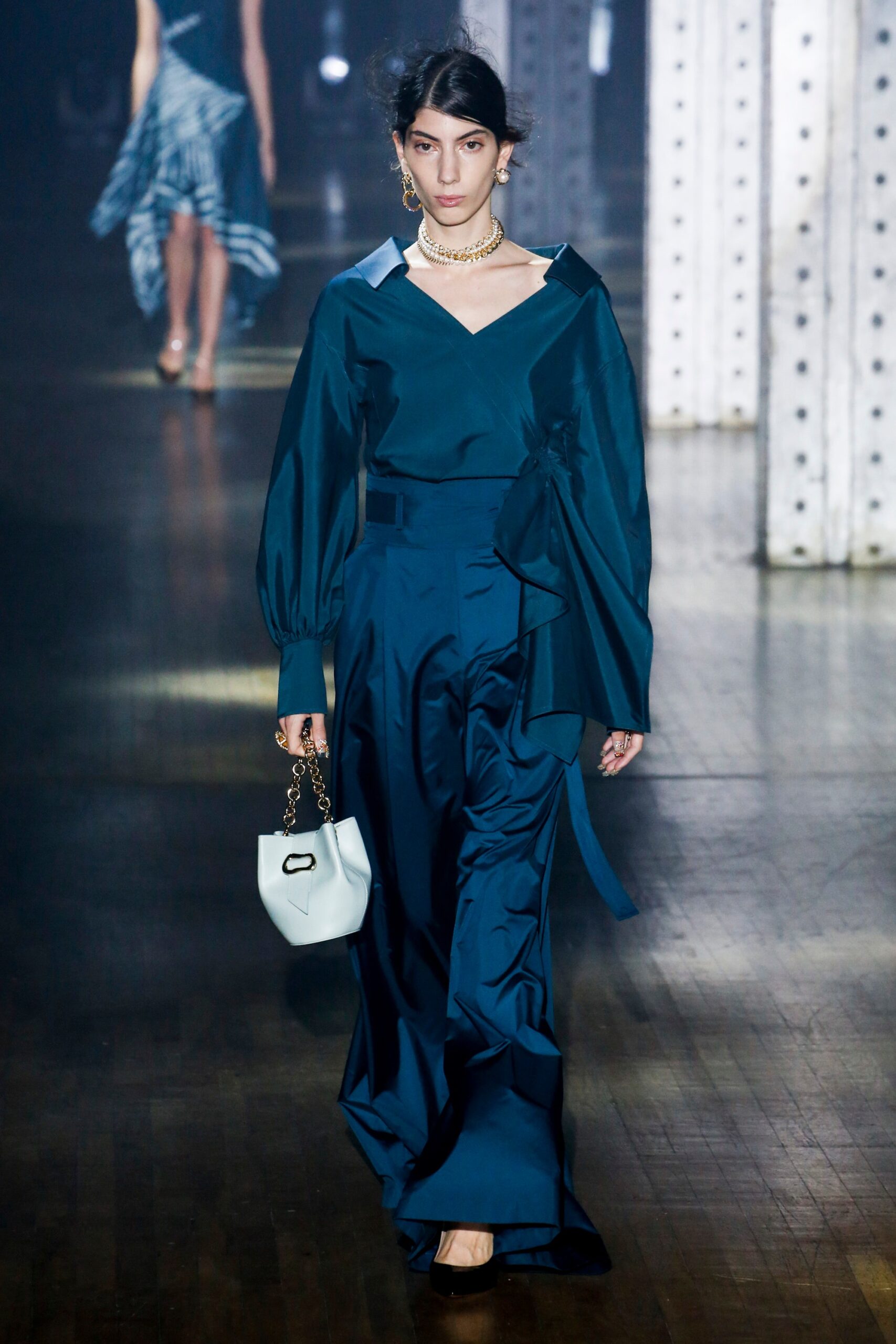 blue silk midi dress with structured bag