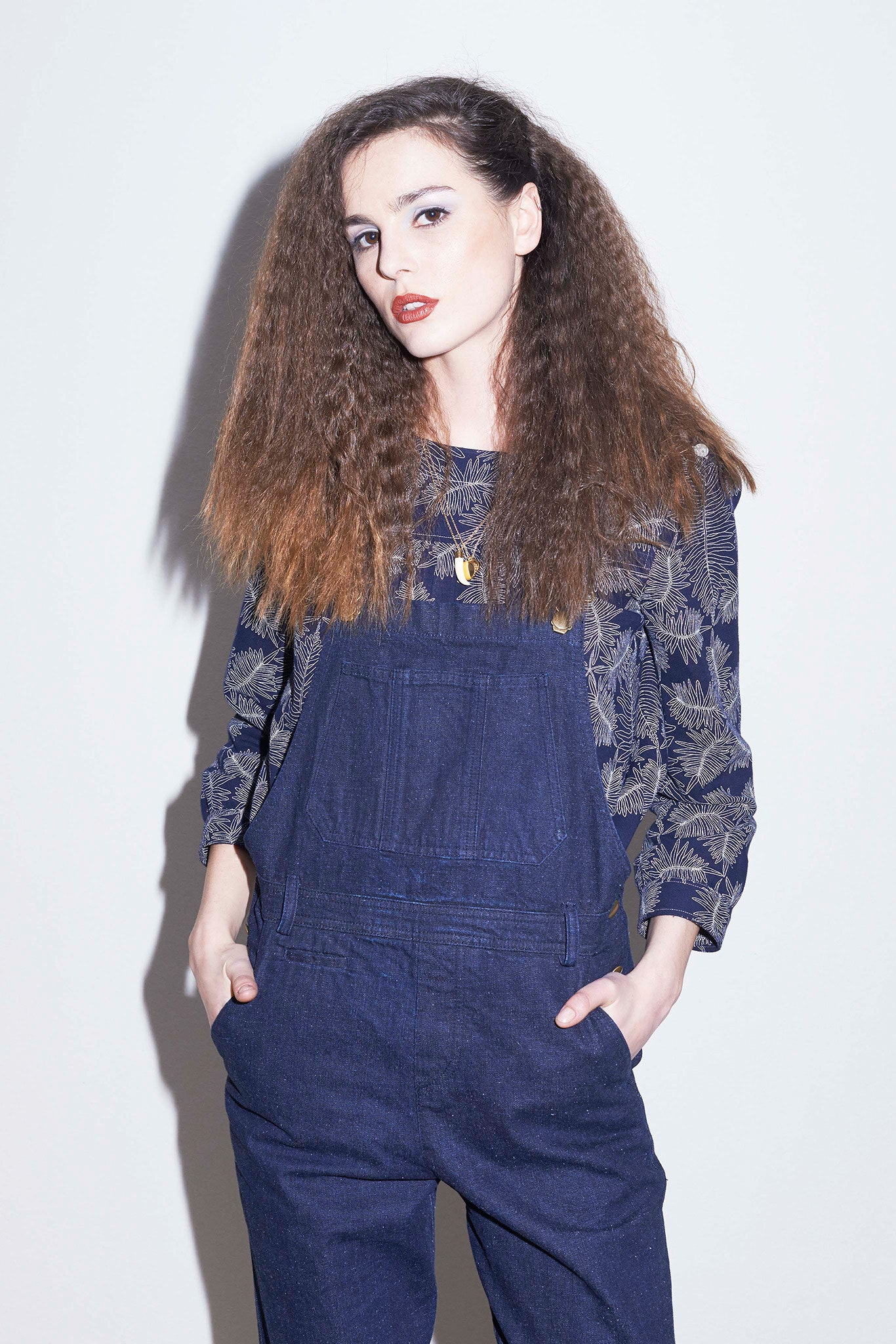 blue denim overalls with printed top