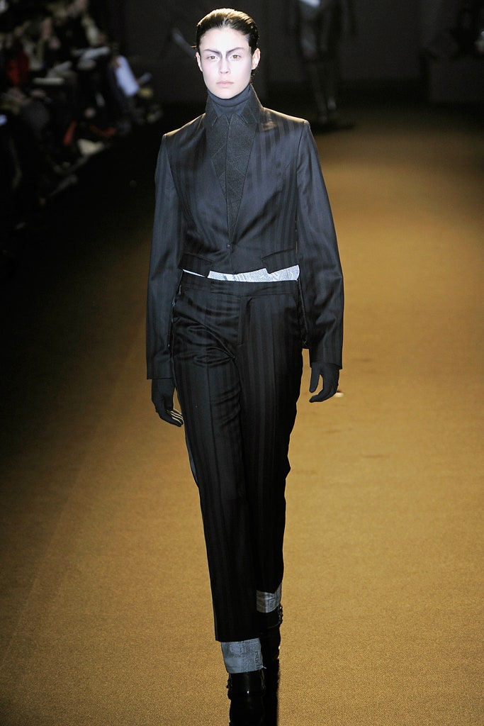 black tailored suit with gloves