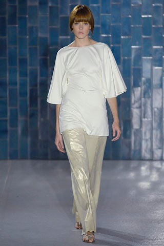 white relaxed top with beige pants