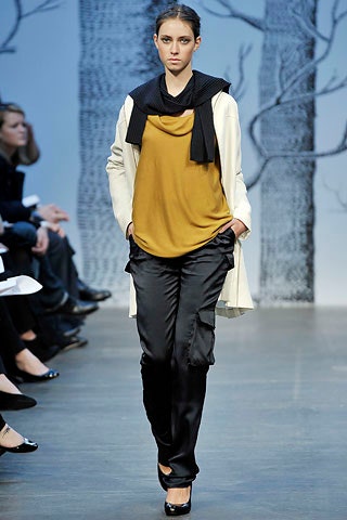 white coat yellow top black pants