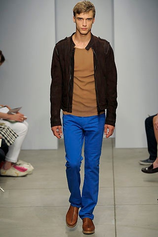 brown leather jacket with blue pants