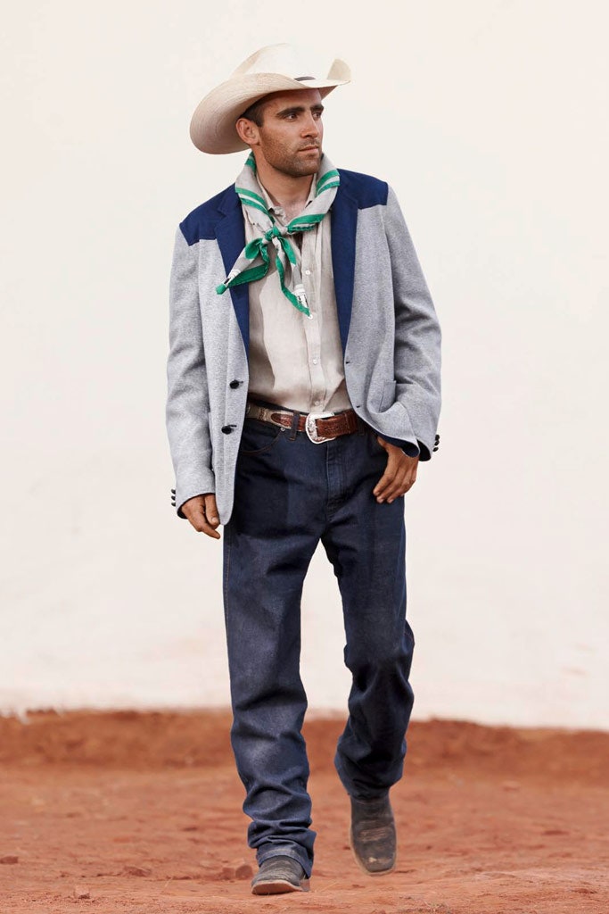 tailored gray jacket with denim pants