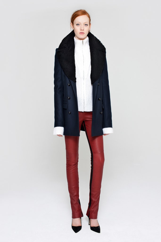 navy coat with fitted top and leather pants