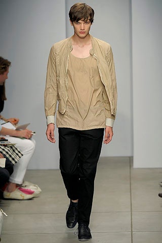 beige fitted jacket with black pants